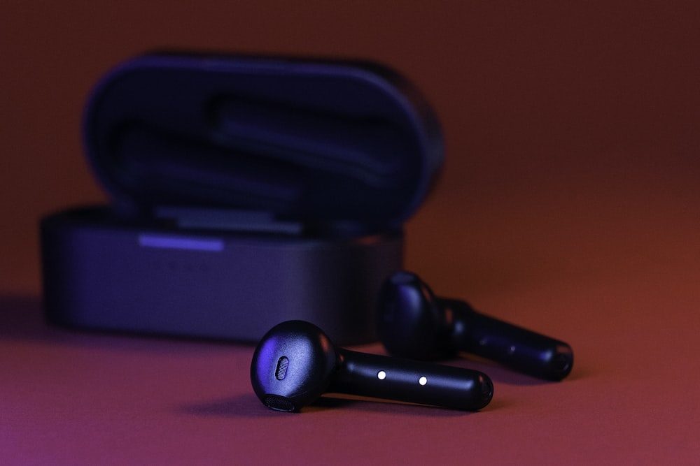 black in-ear headphones.