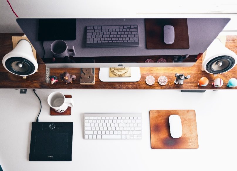 An office workspace with multiple gadgets.